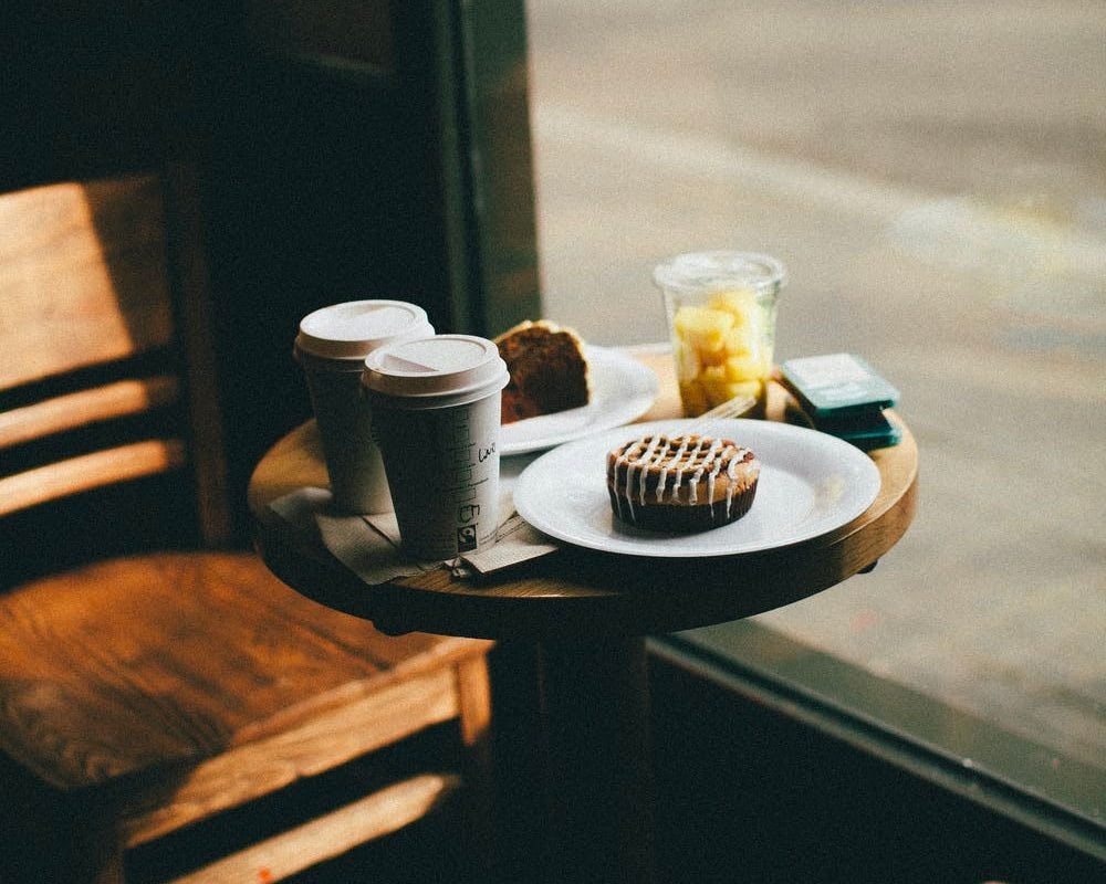 A Little Table, Two Coffees, and Something Sweet